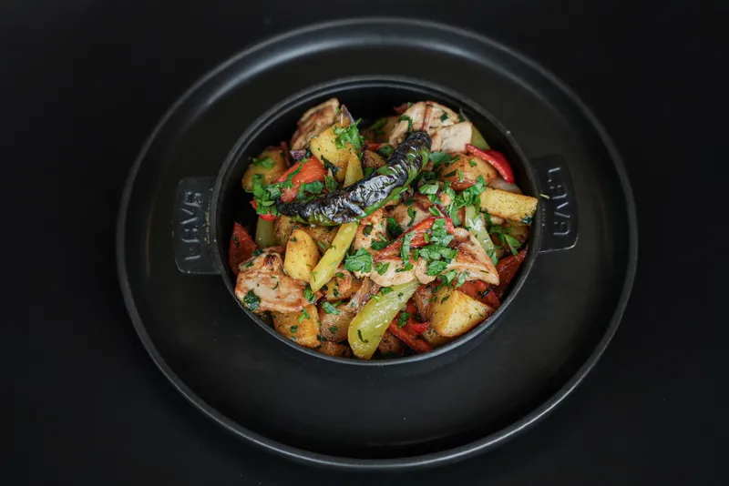 Camp meal with chicken and potatoes for full-board guests